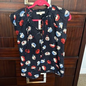Navy blue with white & red flowers short sleeve. Tie in front have never worn it